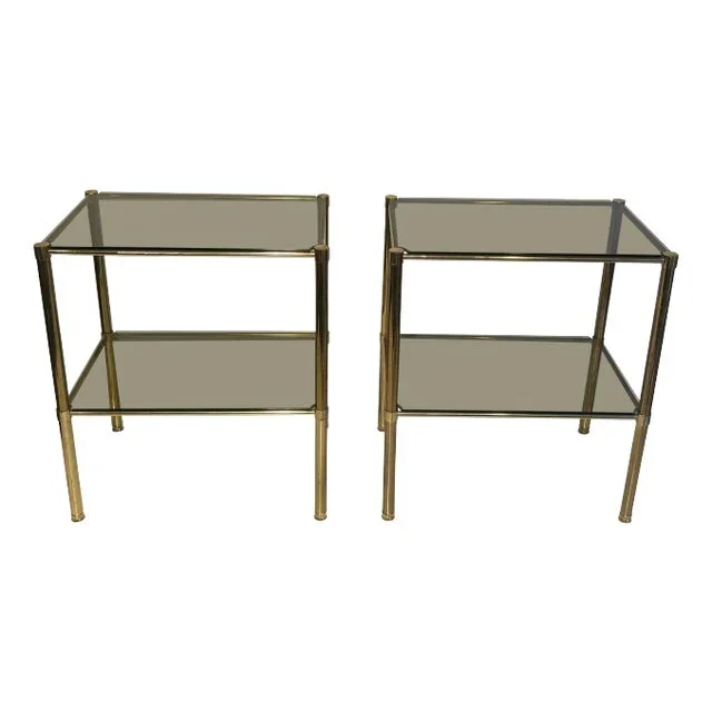 Brass Side Tables With Smoked Glass Shelves. French Work. Circa 1970 – A Pair